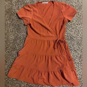 Abercrombie and Fitch tiered wrap mini dress in color burnt orange